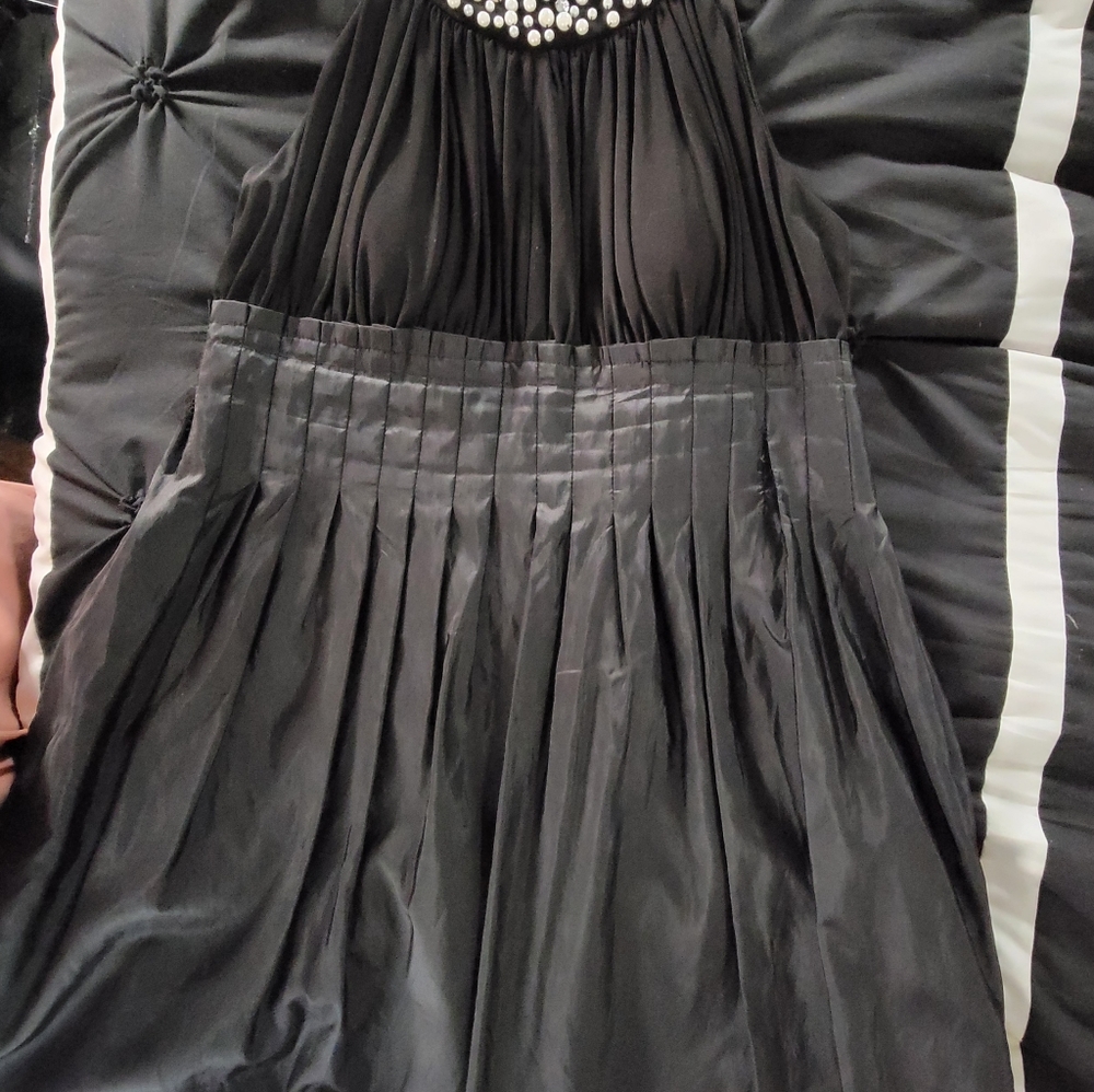 Black Dress taffeta bottom half w/pearl collar. No sleeves. Soft pleats n flare